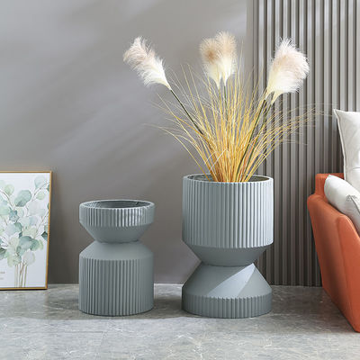 comprar Descubra la belleza de los plantadores de arcilla de fibra para sus plantas de interior y exterior online manufacture